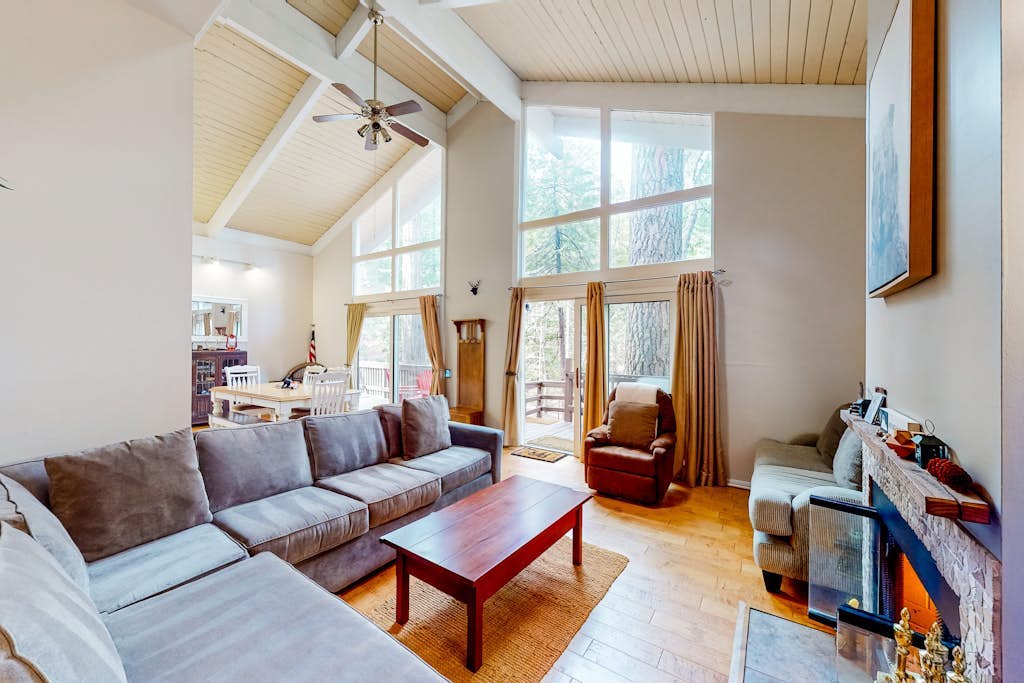 Dog-friendly cabin surrounded by trees and wildlife with fireplace & deck