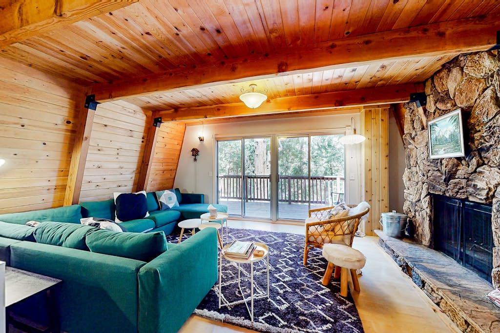 Dog-friendly 2-story home with large deck, tree views, fireplace, & W/D