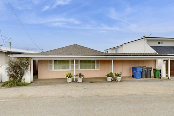 Classic waterfront beach house with a furnished deck & ocean views