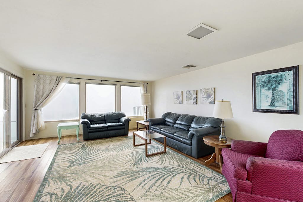 Classic waterfront beach house with a furnished deck & ocean views