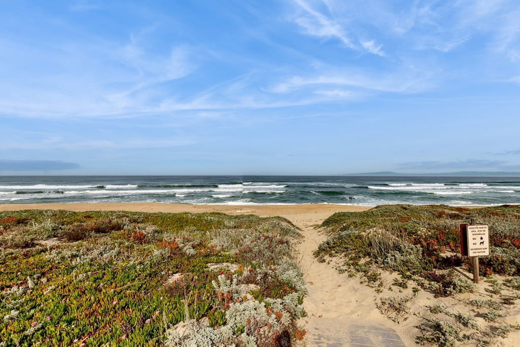 Beachfront condo with private patio, beach access, shared pool & hot tub.