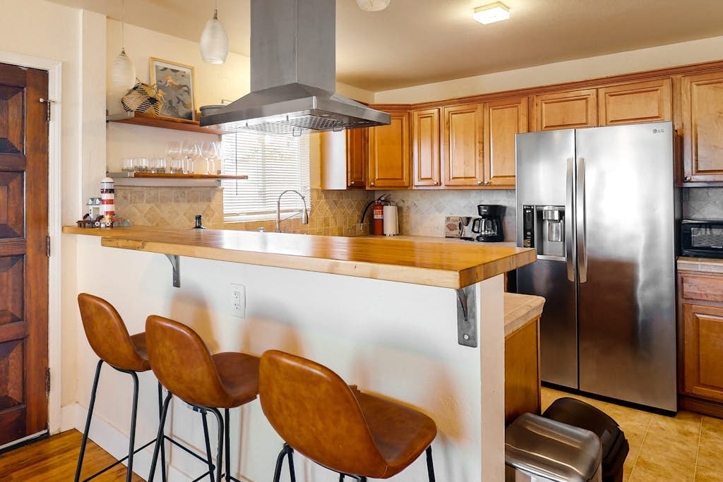 Ocean-view home in great location with backyard deck, grill, streaming, & W/D