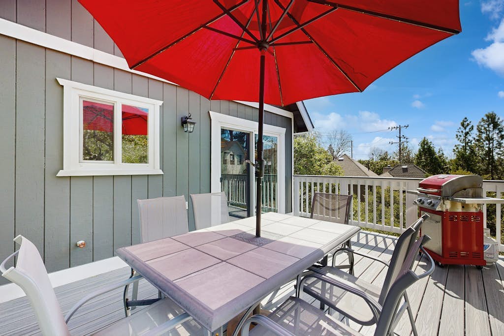 Dog-friendly retreat with covered deck, fireplace, grill, & outdoor dining