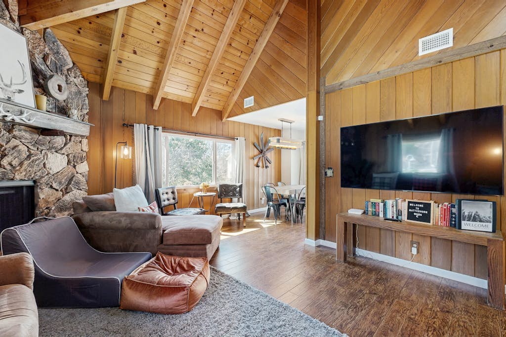 Dog-friendly retreat with covered deck, fireplace, grill, & outdoor dining