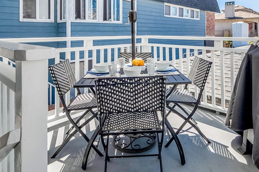 Updated 2nd-floor retreat with deck, AC, 2 car parking- steps from beach
