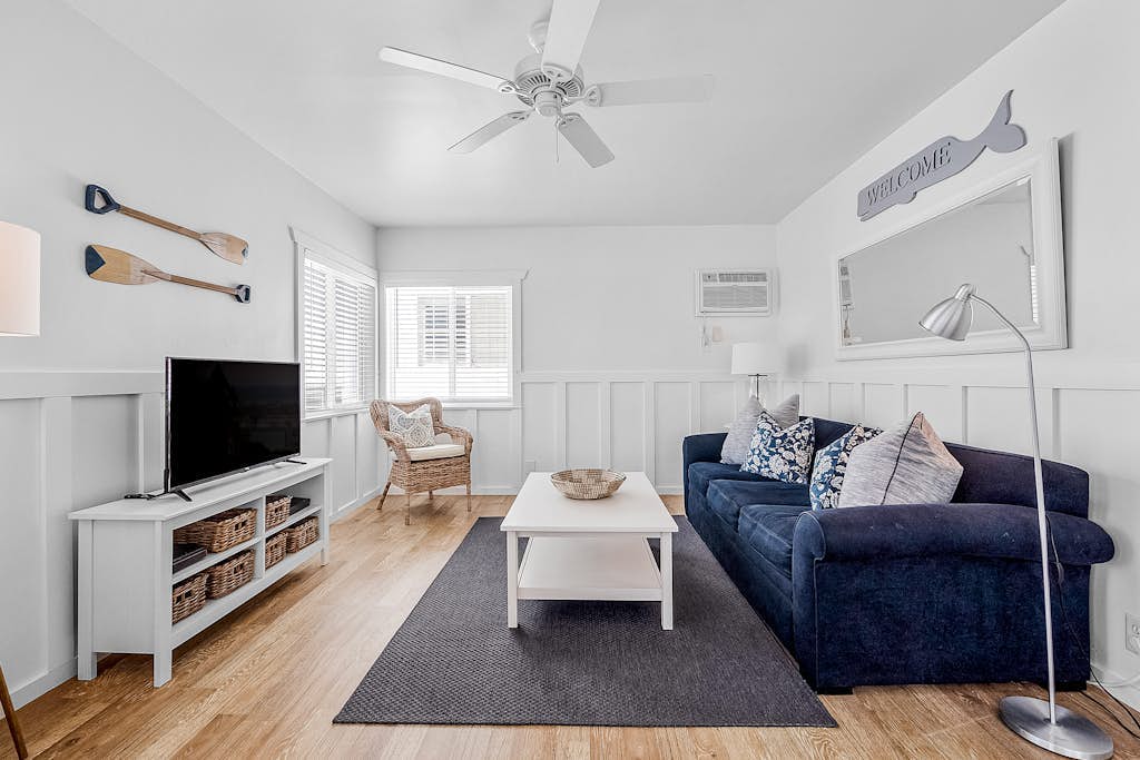 Updated 2nd-floor retreat with deck, AC, 2 car parking- steps from beach