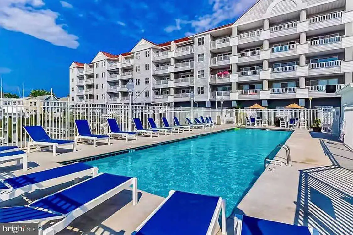 Charming waterfront condo with pool access and private balcony views