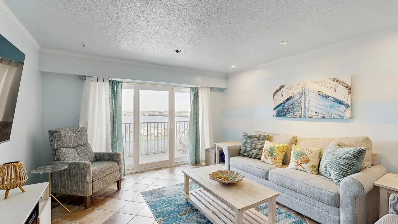 Charming waterfront condo with pool access and private balcony views