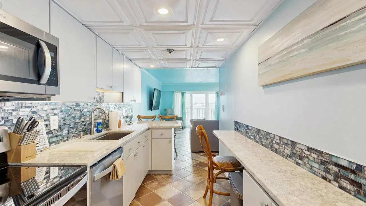 Charming waterfront condo with pool access and private balcony views