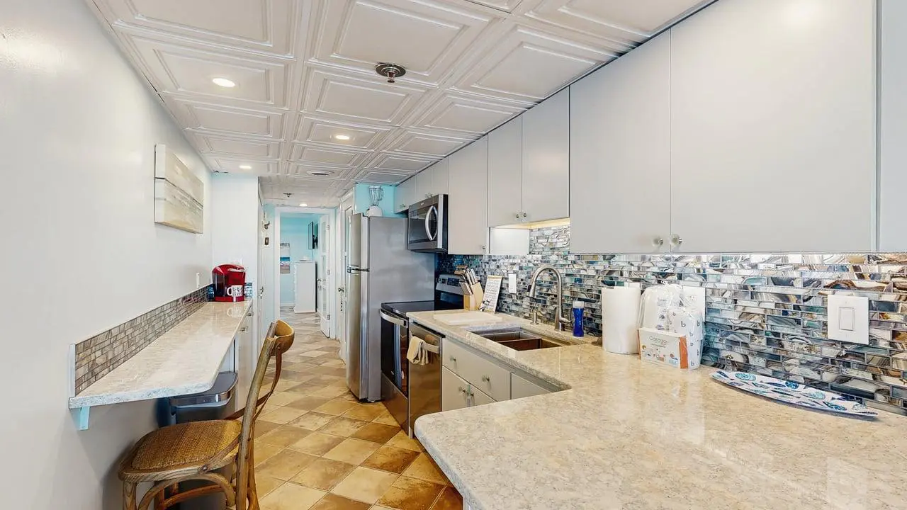 Charming waterfront condo with pool access and private balcony views
