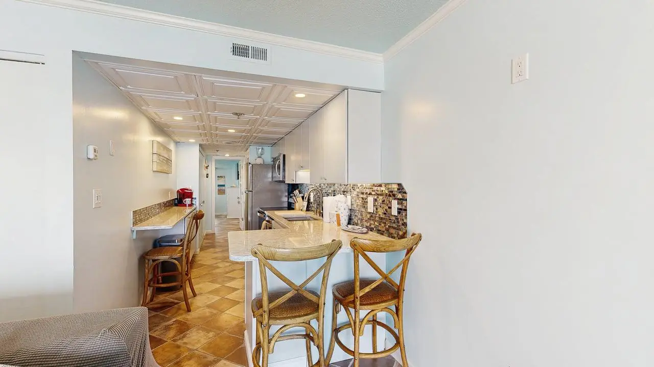 Charming waterfront condo with pool access and private balcony views