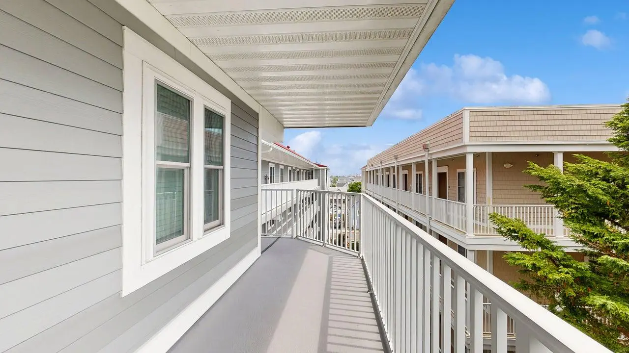 Charming waterfront condo with pool access and private balcony views