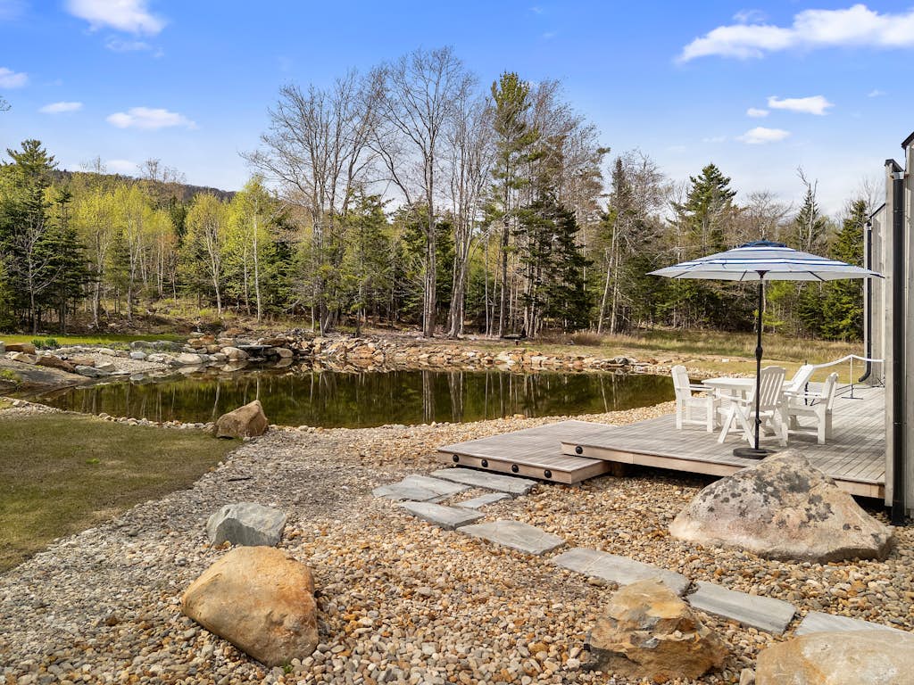 Enjoy tranquil pond views at The Pond House in Lincolnville, ME—2300 sq ft, 3 beds.
