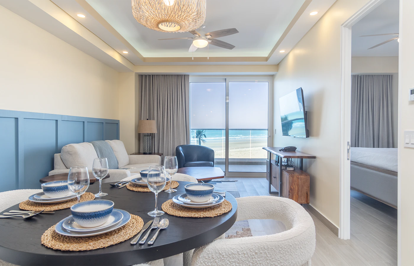 Oceanfront living and dining space at Encantame Towers Viento 303