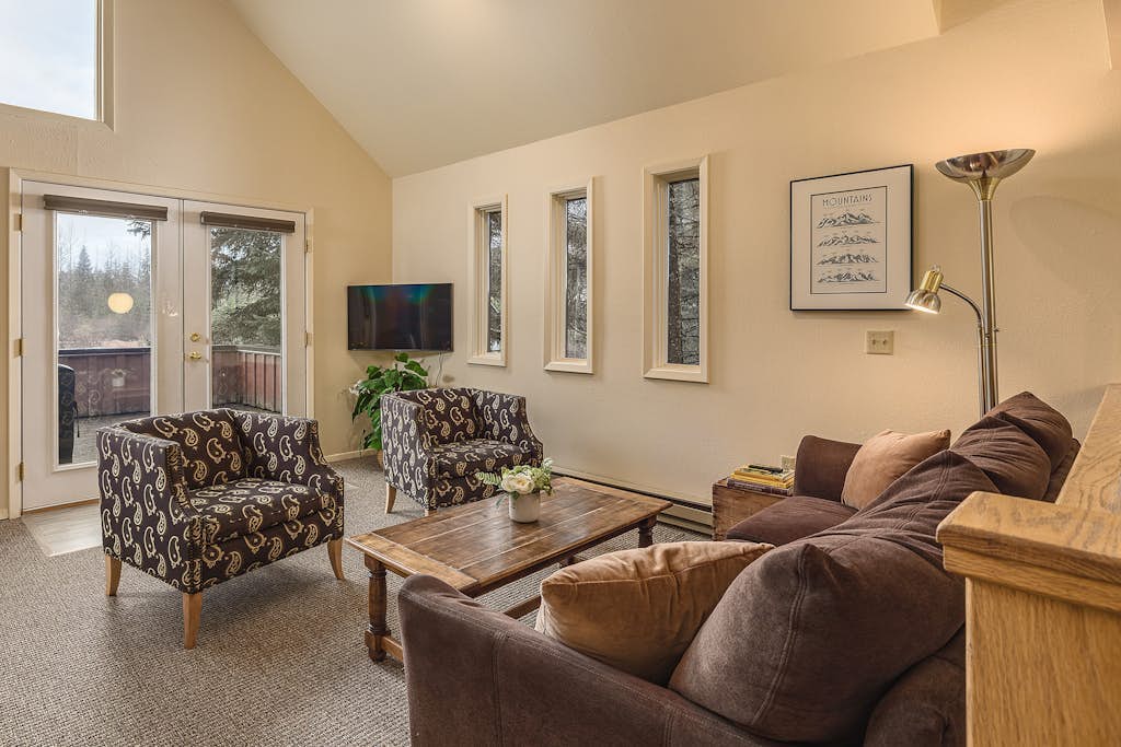 Hidden away in a quiet, peaceful neighborhood just a short half-mile walk to the lifts at Alyeska Resort—close enough to walk in ski gear, far enough that the neighborhood stays quiet. This charming four-bedroom home features an exceptional western exposure that fills the open living spaces with natural afternoon light across all seasons. The spacious floor plan features a roomy viewing deck with a gas grill for summer cookouts, a well-equipped full kitchen built to handle family meal times with ease, and complimentary high-speed WiFi. Settle in for a quiet weekend or use the home as a reliable staging point for day trips to Portage Valley, Crow Creek Mine, or the Kenai Peninsula. Standard Specs: Fully equipped kitchen, private viewing deck, gas grill, private in-unit washer/dryer, flat-screen TV, complimentary high-speed WiFi, and hospitality check-in instructions. Driveway parking for up to four vehicles. Quiet residential neighborhood. Sleeps 8.