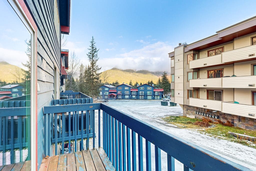 Multi-level, multi-window, and engineered from the ground up to make a ski week completely effortless. This bright, open-concept townhouse sits ski-in/ski-out at the direct base of Alyeska Ski Resort, providing sweeping mountain views throughout the main living areas. An authentic wood-burning fireplace anchors the central living room floor, while a master king and queen bedroom configuration handles the sleeping space. Ditch the car keys entirely—The Bake Shop, La Bodega, and Sitzmark Bar & Grill are located right outside your door, and a shared building sauna waits to handle trail recovery. Standard Specs: Fully equipped kitchen with dishwasher, traditional wood-burning fireplace, private balcony, flat-screen TV with Netflix streaming, high-speed WiFi, keypad entry, and shared building laundry/sauna access. Dedicated parking for two vehicles. True ski-in/ski-out. Sleeps 7.