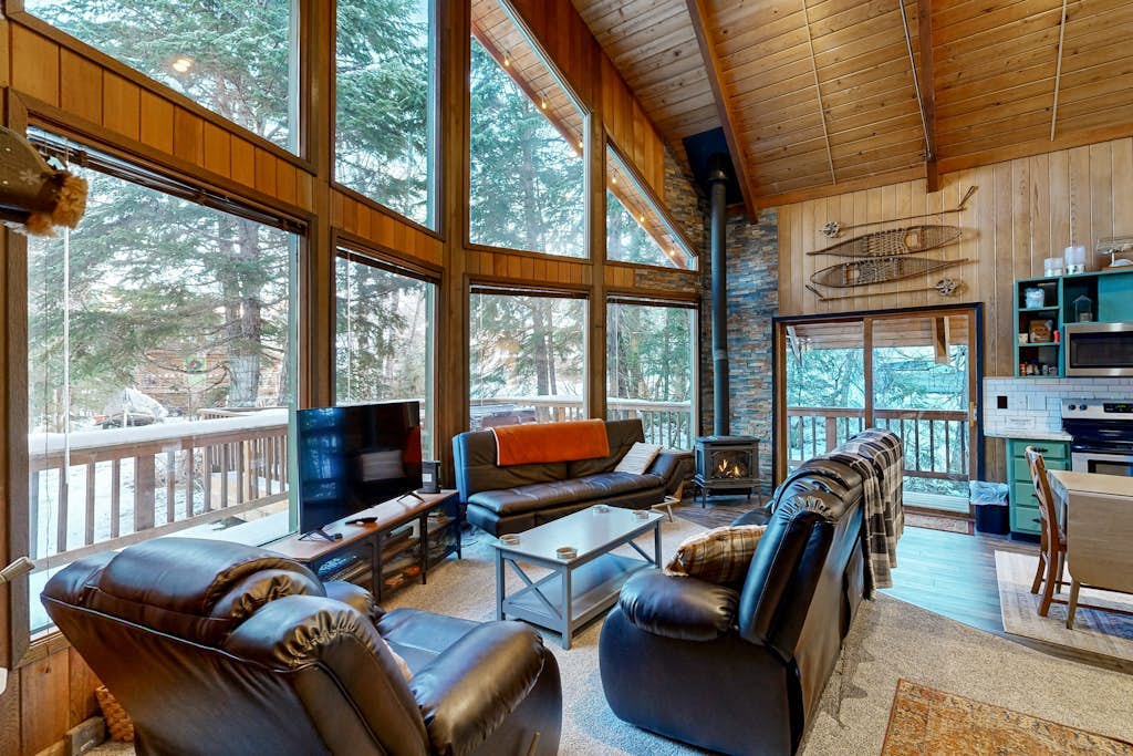 Some properties are styled to look like old Girdwood. This one actually is Girdwood. Preserving the architectural culture of the valley's early ski days, this classic A-frame chalet features original open-beam wood interiors, towering windows, and an open floor plan that lets the mountain light all the way in. Modern updates are placed thoughtfully where they matter most—including a reliable gas heating stove and a traditional, wood-powered cedar barrel sauna right outside the front door to handle muscle recovery. Located in an established neighborhood close to the hill, it sits directly on the paved path running toward Virgin Creek Falls trailhead. Standard Specs: Full kitchen with dishwasher, private washer/dryer, flat-screen TV, high-speed WiFi, and keypad entry. Dedicated parking for two vehicles. Guests can easily purchase firewood for the sauna locally. Sleeps 5.