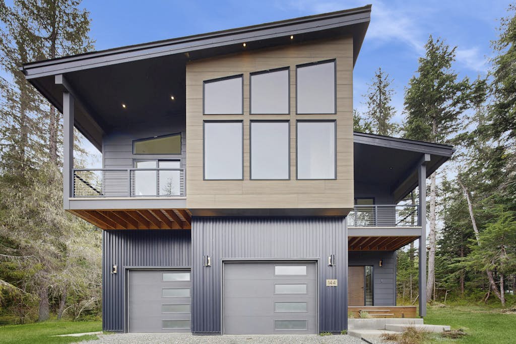 Constructed brand new in 2021 with sharp contemporary finishes and expansive viewing windows that frame the surrounding Chugach peaks, Glacier View Getaway makes a powerful case for the modern Girdwood home. Built specifically for large family groups and outdoor teams who want space without losing a classic mountain feel, the four-bedroom house features an open-concept kitchen built for real cooking and a massive, dedicated lower-level game room equipped with a custom foosball table. Positioned just minutes from Alyeska Resort, Girdwood Brewing Company, and local trailheads. Standard Specs: Gourmet full kitchen, private lower-level game room with foosball, contemporary finishes, large-capacity windows, flat-screen TV, high-speed WiFi, and keypad entry. Driveway parking for two vehicles. Sleeps 11.