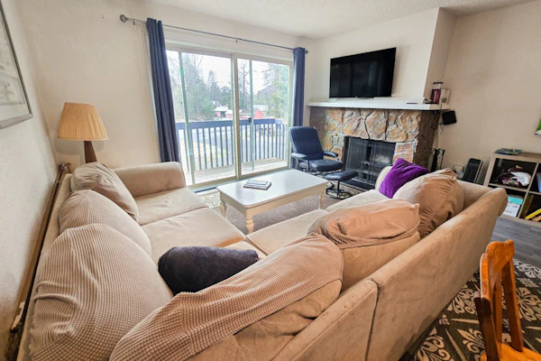 A short walk from the Alyeska lifts, this Girdwood condo trades the logistics for ease — clip in near the door, ski back when your legs are done, and let the rest of the day sort itself out. The living room is built for the wind-down, warmed by a fireplace, with a balcony that frames the surrounding peaks and a full kitchen ready for cooking in rather than heading back out. Two king beds suit two couples or a small family, and the combination tub/shower is a welcome thing after a cold day on the snow. Downhill terrain and Nordic tracks both sit within reach, and when the snow goes the same country opens up for hiking, mountain biking, and bird and wildlife watching, with the resort spa and village dining close by. Standard Specs: Full kitchen, two king beds, fireplace, private balcony, combination tub/shower, high-speed WiFi, and cable TV/DVD. No air-conditioning. Free parking for two vehicles. Sleeps 4.