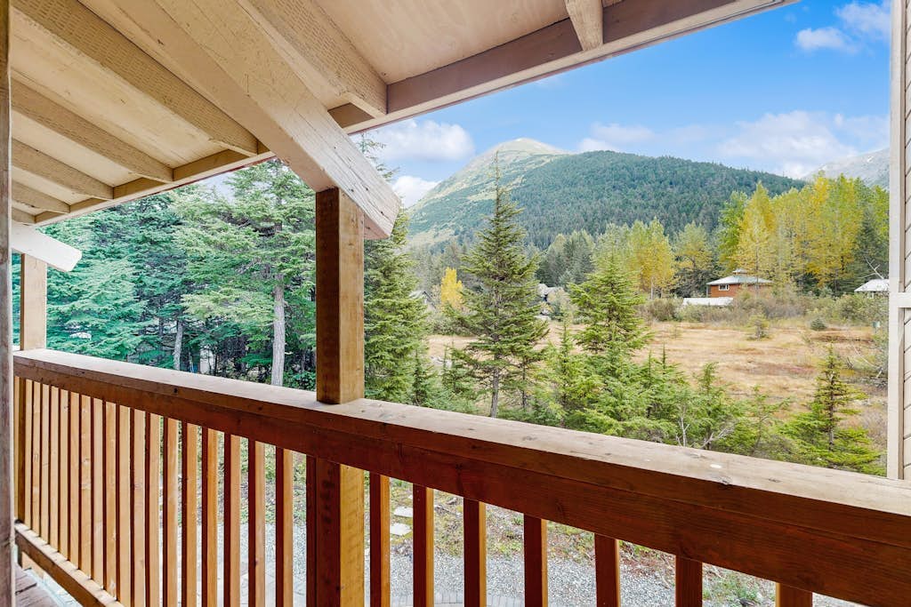Sprawling across four distinct structural floors and completely enclosed by a serene, old-growth spruce forest, Vail Meadows Chalet is the ultimate four-season mountain basecamp. Located a short half-mile walk from world-famous Alyeska Resort, this commanding home handles large group campaigns with total ease. Winter trips focus around an authentic wood stove, an indoor private dry sauna, and direct slope access for fat-tire biking or skiing. Long summer days center around a private stone patio and fire pit with completely unobstructed mountain views, surrounded by high-bush blueberry and salmonberry bushes. Features a cozy loft, multiple king suites, a custom bunk room, and children's amenities. Standard Specs: Fully equipped kitchen, private indoor dry sauna, outdoor stone patio with fire pit, wood stove, covered viewing deck, child's high chair/Pack-N-Play, Smart TV, board games, high-speed WiFi, and keypad entry. Driveway parking for three vehicles on a quiet cul-de-sac. Sleeps 8.