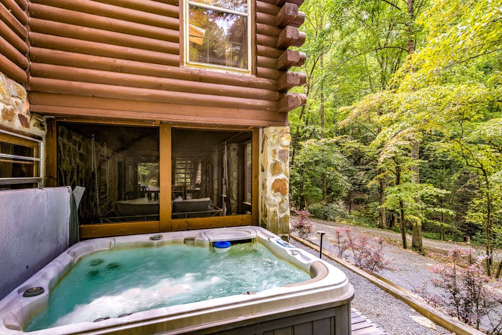 Stunning dog-friendly cabin with hot tub, firepit, game room, & washer/dryer