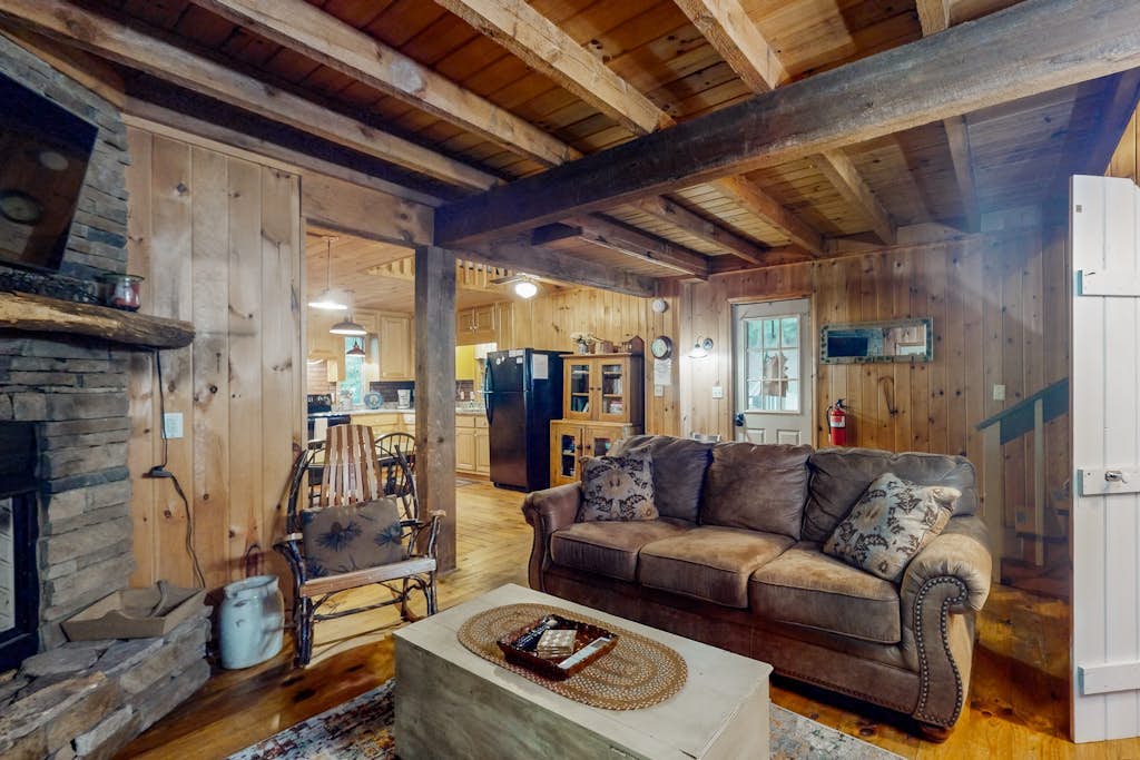 Charming, dog-friendly cabin with a private hot tub, outdoor fireplace, & yard