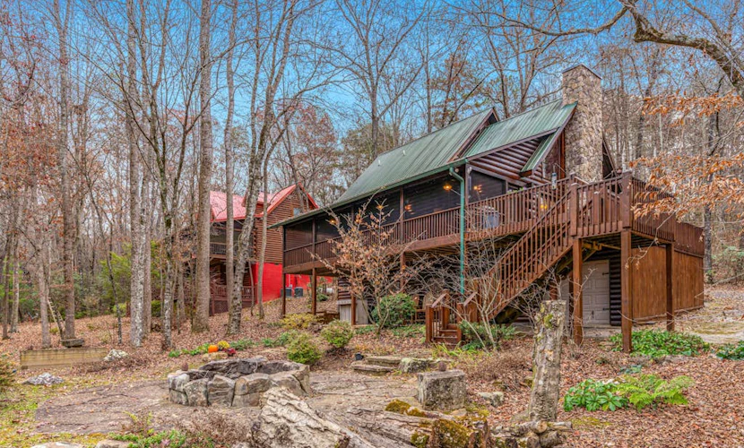 Waterfront retreat with a deck, grill, fireplace, board games, W/D, & central AC