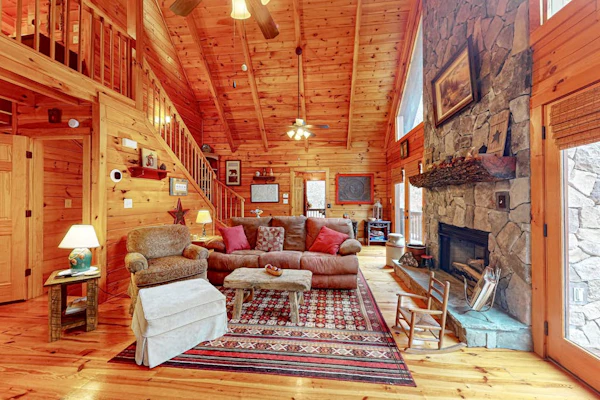 Waterfront retreat with a deck, grill, fireplace, board games, W/D, & central AC
