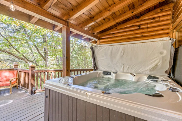 Dog-friendly mountain cabin with deck, hot tub, firepit, fireplace, W/D, & AC