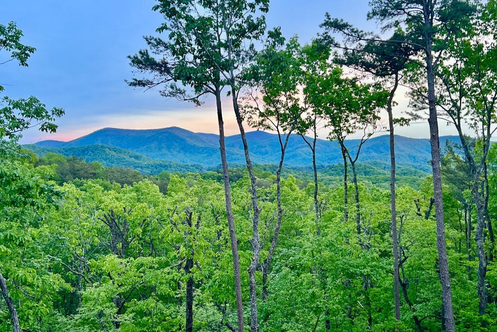 Gated mountaintop retreat with expansive outdoor living, game tables, & hot tub