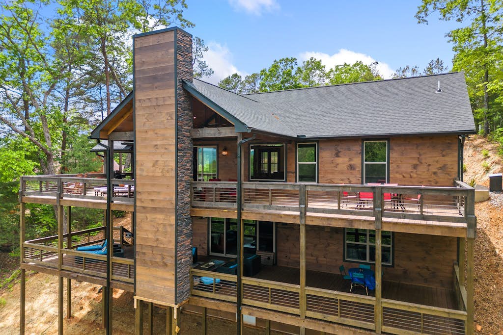 Gated mountaintop retreat with expansive outdoor living, game tables, & hot tub