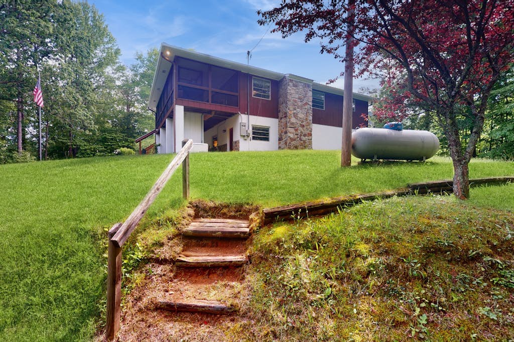 Water-view cabin near golf with fireplace, deck & firepit - snowbird-friendly