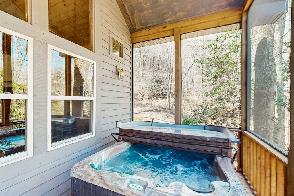 Lovely riverfront cabin in secluded setting w/ private hot tub, deck, & firepit