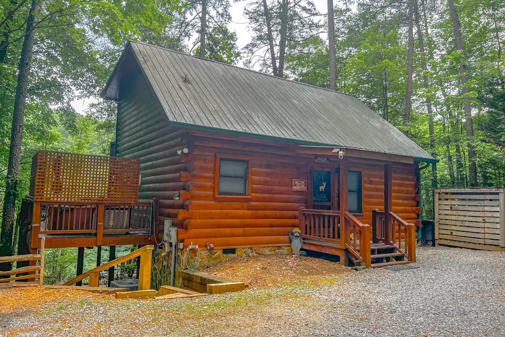 Charming, Waterfront Cabin with a Private Hot Tub, Lakeside Firepit, and Dock