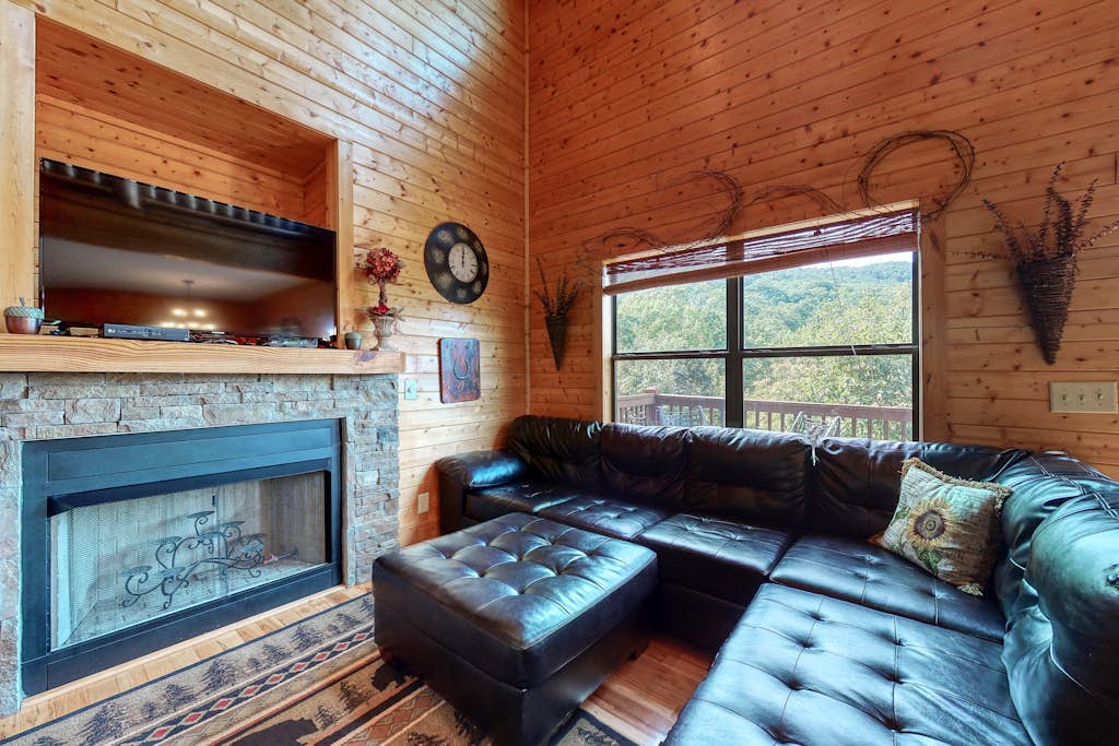 Dog-friendly mountain cabin with a furnished deck, game room & private hot tub