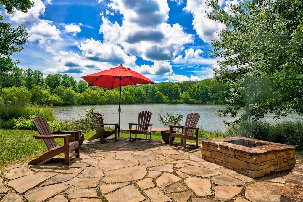 Luxe lakefront retreat with fishing dock, deck, firepit, patio & pool table