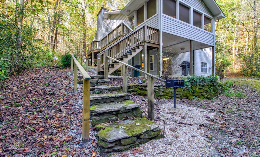 Dog-friendly creekfront cabin on 2.5 wooded acres with game room, screened porch