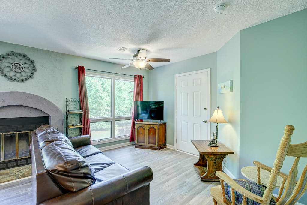 Dog-friendly waterfront condo with furnished patio & fireplace - right in town