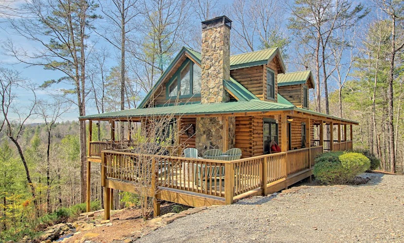 Secluded home on acreage with private hot tub, fireplace & wraparound deck