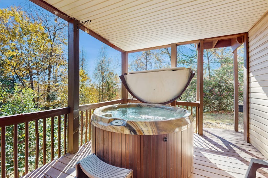 Dog-friendly home with serene views, outdoor hot tub, deck, and fire pit