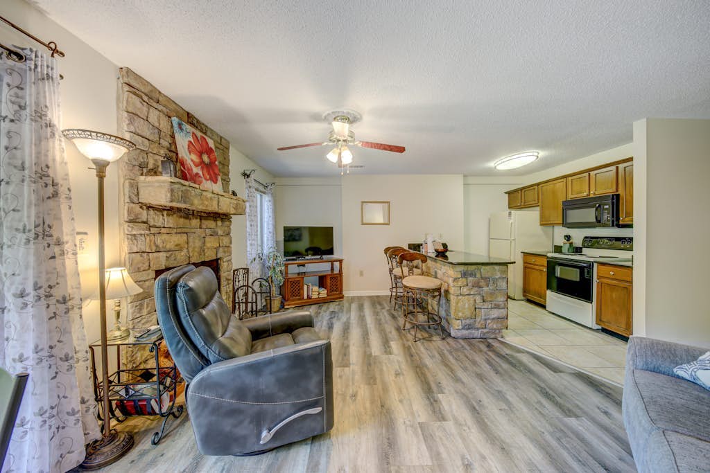 Dog-friendly waterfront condo with full kitchen, furnished deck and river views