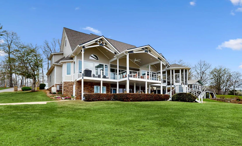 Stunning lakefront home with kayaks, dock, fireplace, game room, & washer/dryer