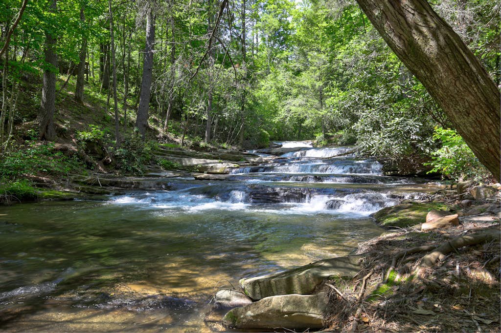 Dog-friendly riverfront cabin w/ waterfall view, large decks, firepit, Ping-Pong