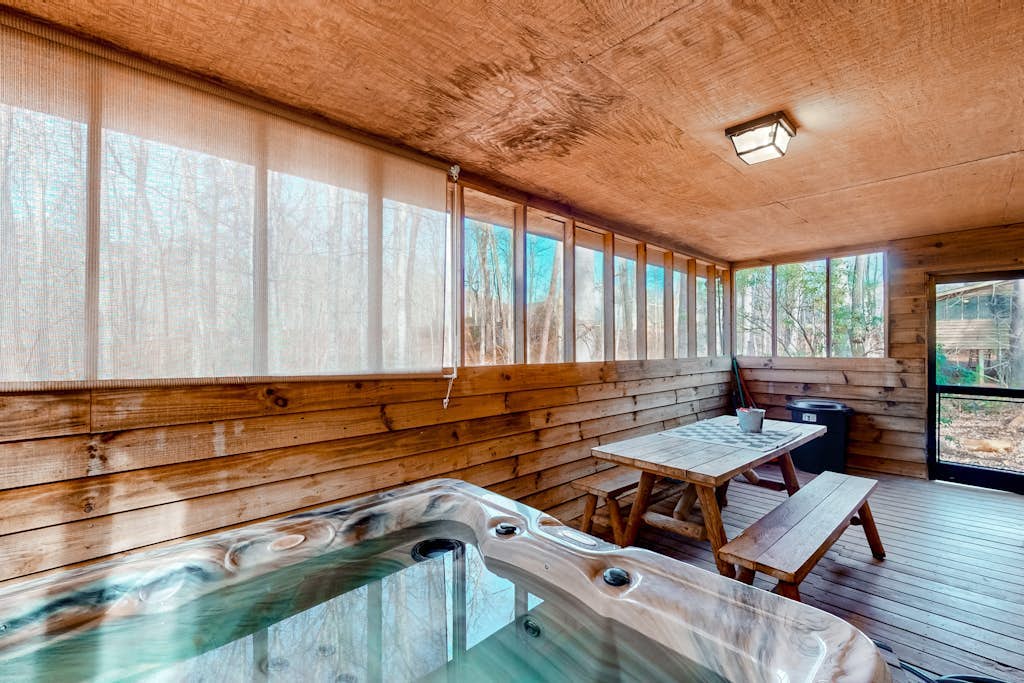 Dog-friendly cabin with private hot tub, wood fireplace, firepit, & washer/dryer