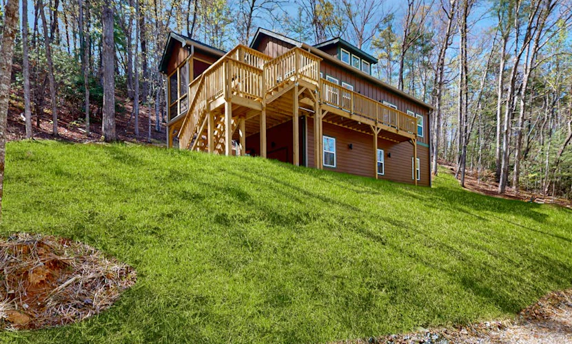 Modern farm style, dog friendly cabin with game room and screened in deck
