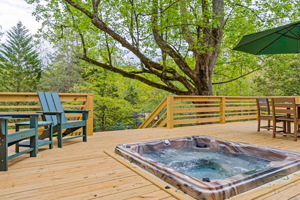 Rustic retreat with mountain views, hot tub, grill, fireplace, central AC, & W/D