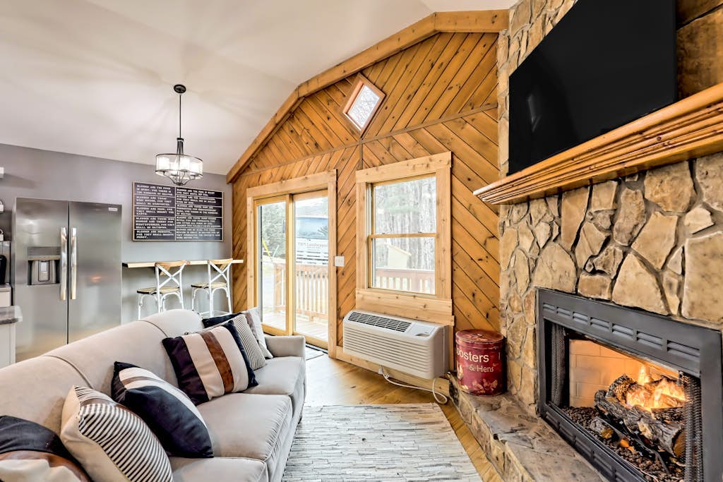 The Coop | Woodland cabin in Blairsville with wraparound porch & fireplace