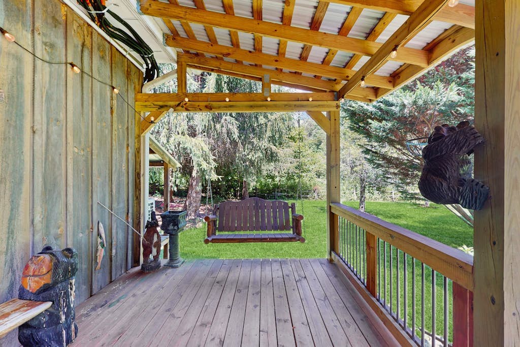 Serene waterfront home with firepit, deck, & central AC
