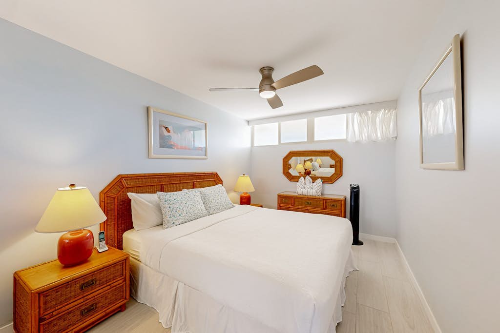 Ocean-view condo with balcony, pool, & sun loungers - walk to beach