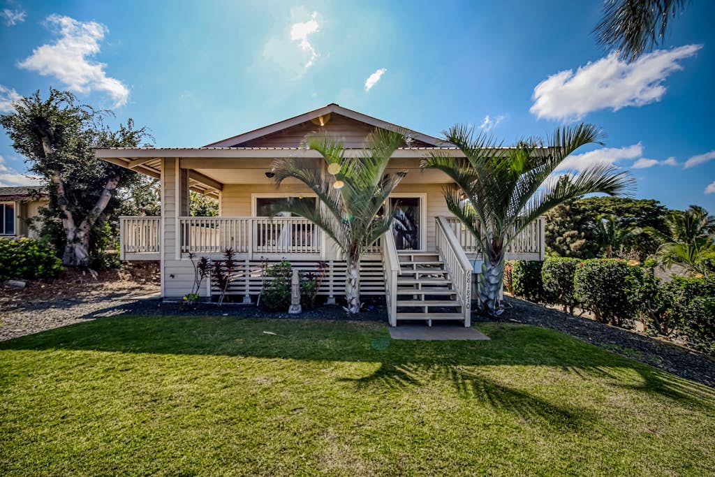 Newly updated home with pools, lanai, ocean view - walk to golf